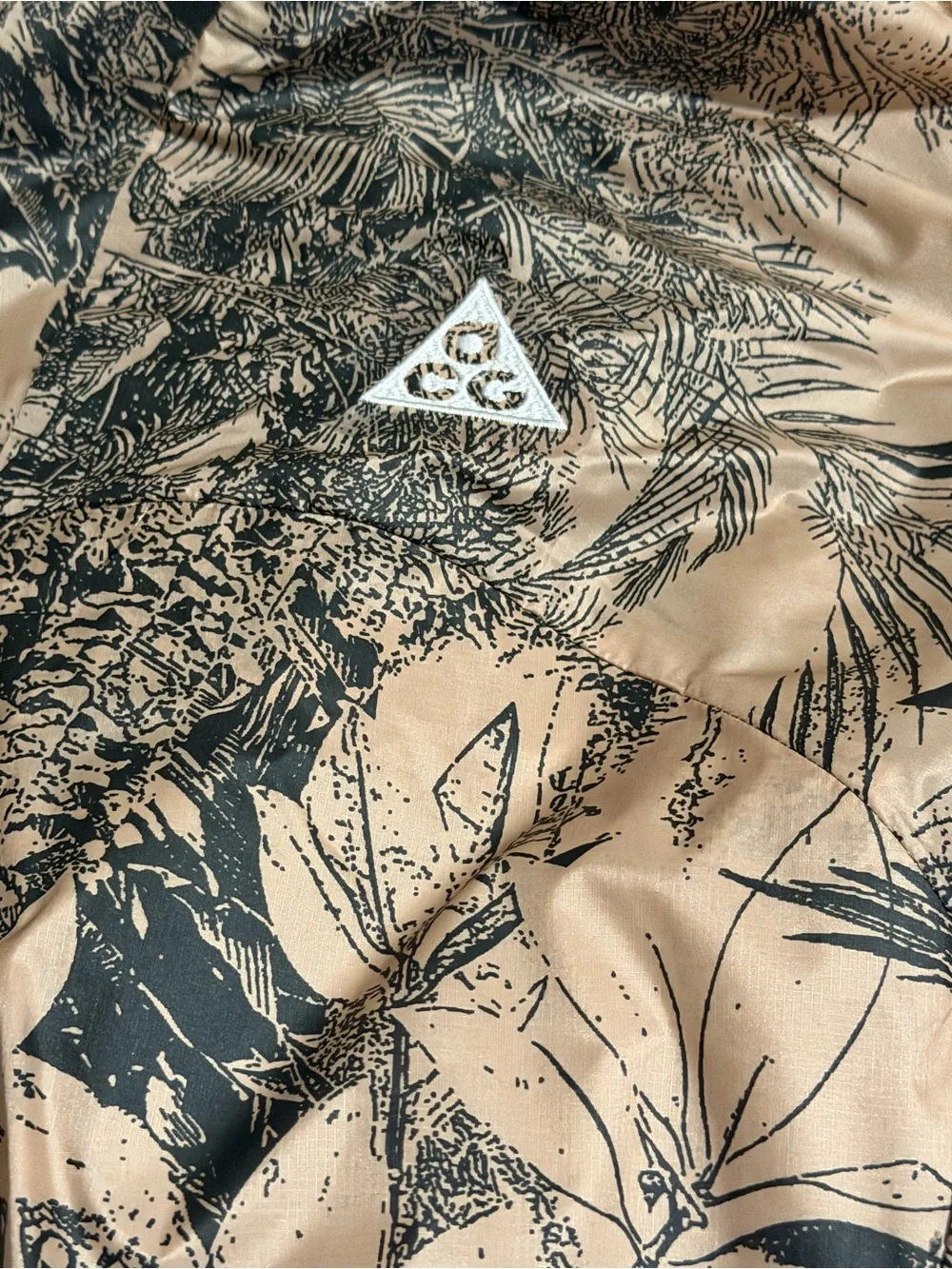 Nike ACG Hooded Jacket in Desert Tan and Black Nature Print